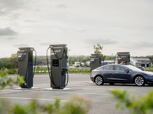 image of charging stations and a car in a parking lot